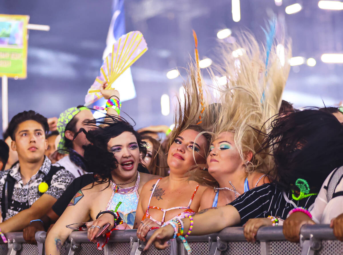 Attendees headbang as Excision performs at the Circuit Grounds stage during the first day of th ...