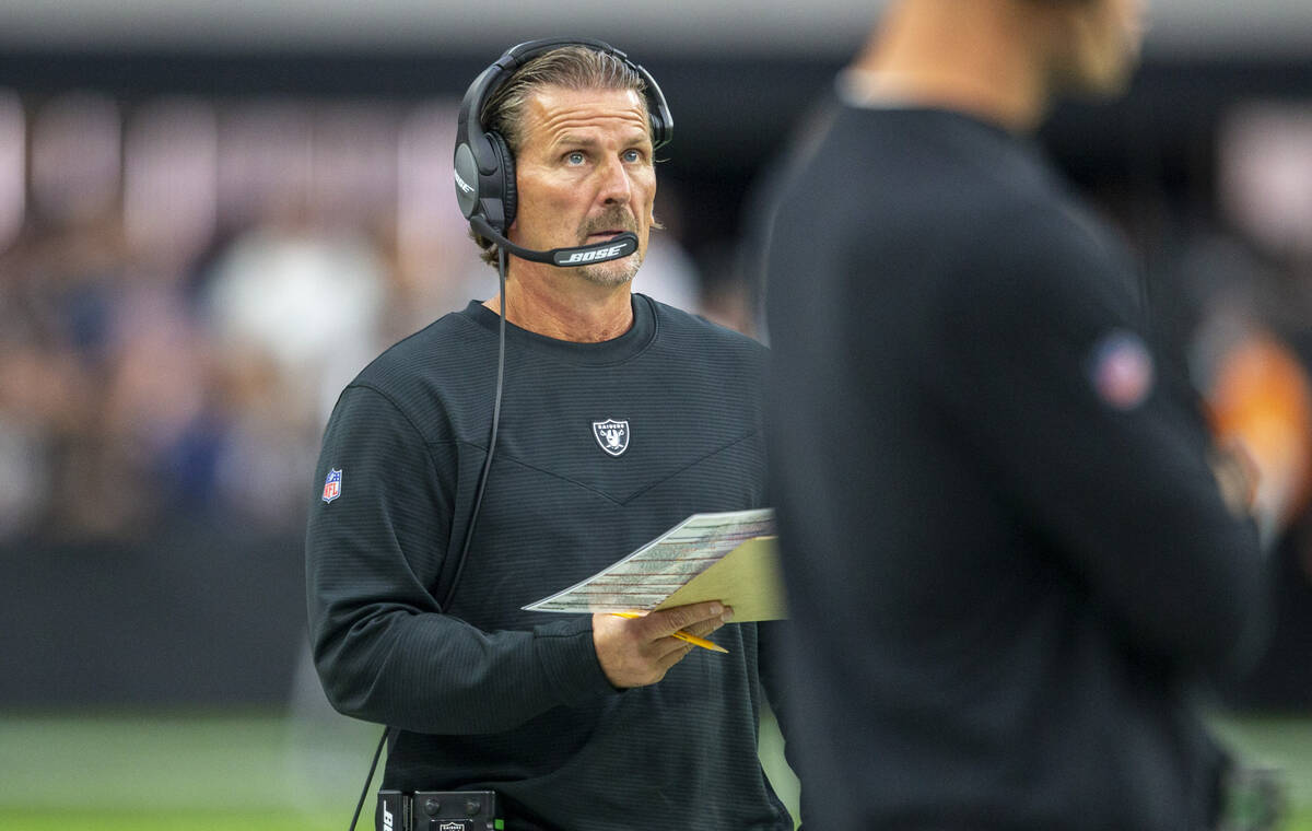 Raiders offensive coordinator Greg Olson coaches from the sideline during the first quarter of ...