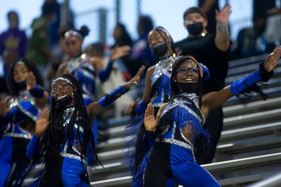 Desert Pines cheerleaders cheer on their team during the first half of a high school football g ...
