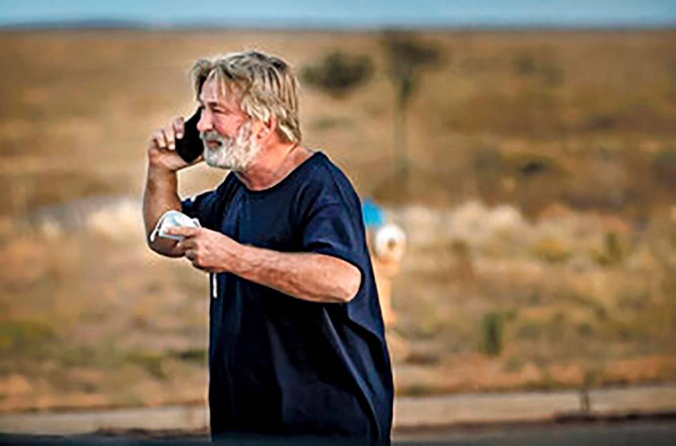 Alec Baldwin speaks on the phone in the parking lot outside the Santa Fe County Sheriff's Offic ...