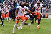 Illinois wide receiver Carlos Sandy (11) and linebacker Khalan Tolson (45) celebrate their 20-1 ...