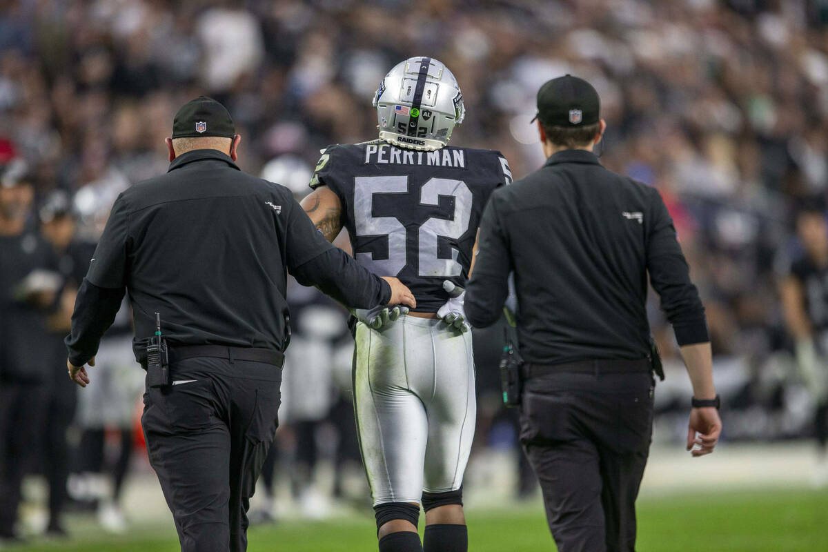 Raiders middle linebacker Denzel Perryman (52) walks off the field after being injured during t ...
