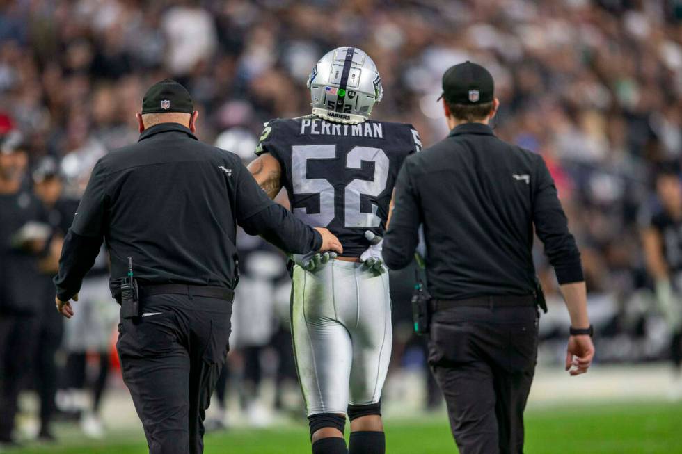 Raiders middle linebacker Denzel Perryman (52) walks off the field after being injured during t ...