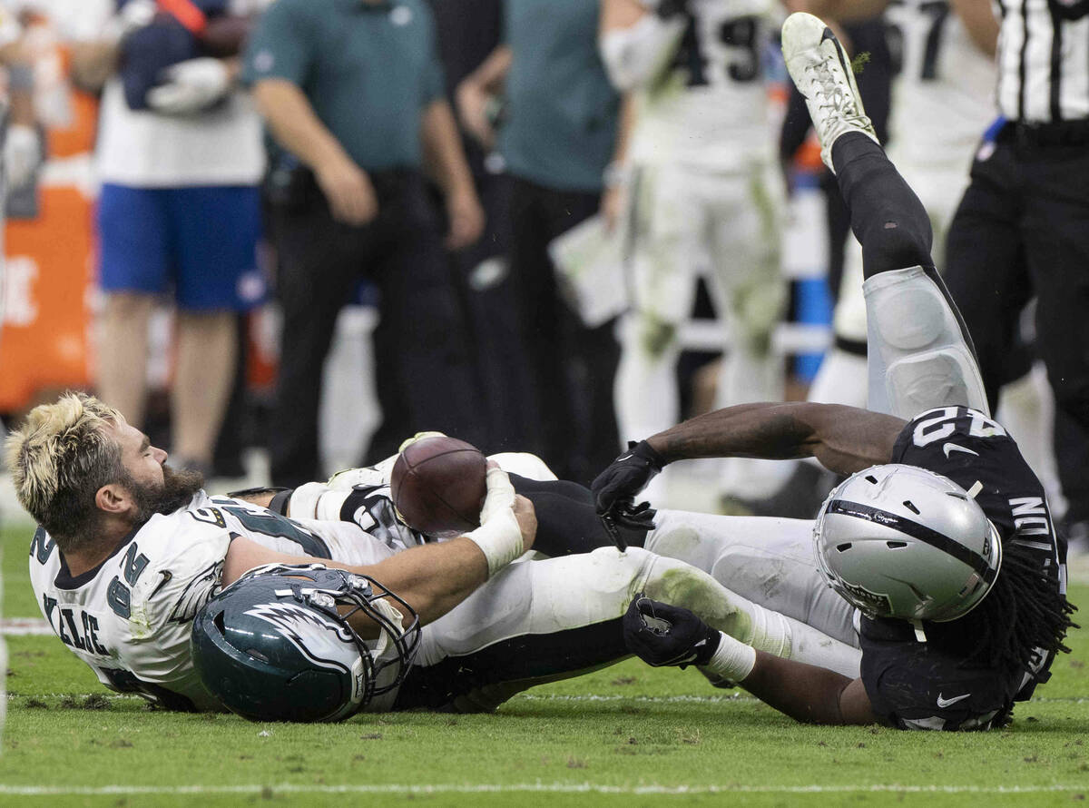 Philadelphia Eagles center Jason Kelce (62) fights for a fumble with Raiders inside linebacker ...