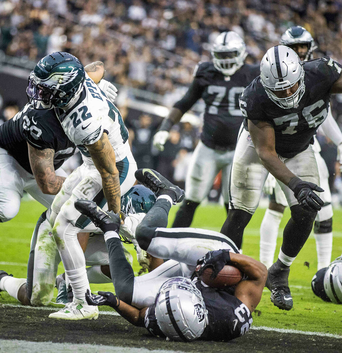 Raiders running back Kenyan Drake (23) rolls into the end zone for a score over the Philadelphi ...
