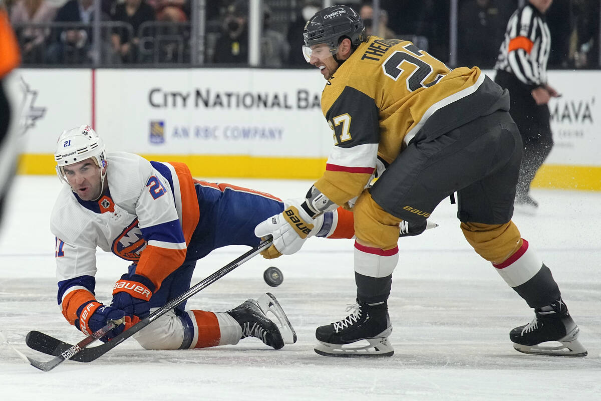 New York Islanders right wing Kyle Palmieri (21) and Vegas Golden Knights defenseman Shea Theod ...