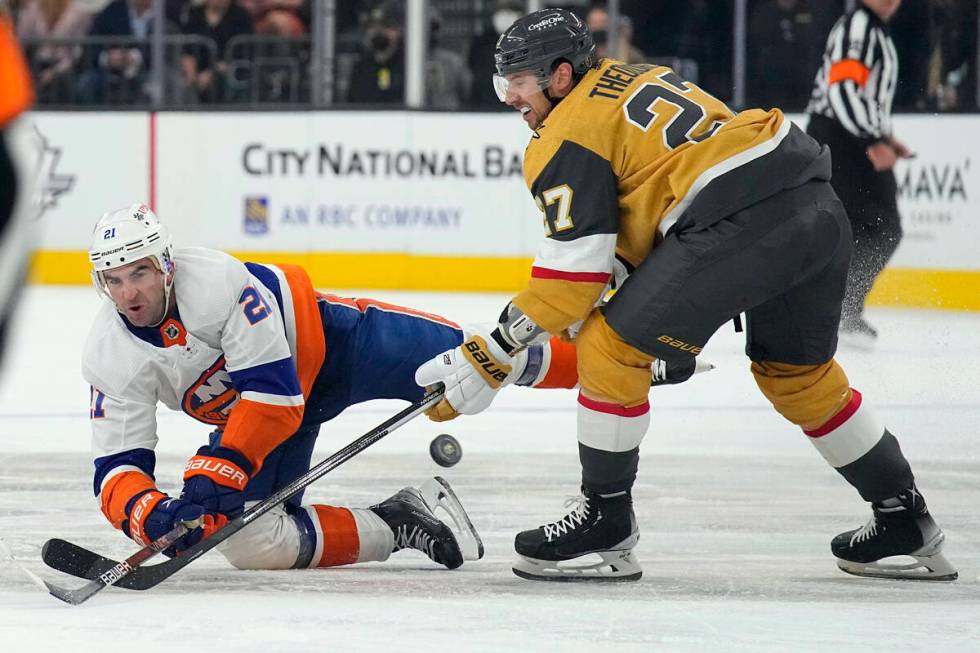 New York Islanders right wing Kyle Palmieri (21) and Vegas Golden Knights defenseman Shea Theod ...