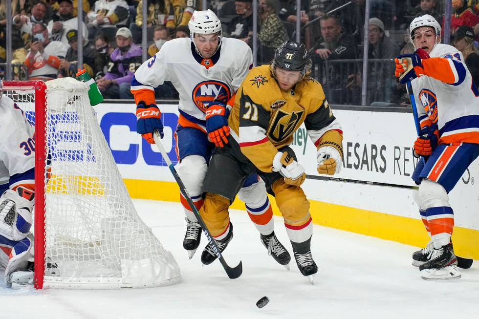 New York Islanders defenseman Adam Pelech (3) and Vegas Golden Knights William Karlsson battle ...