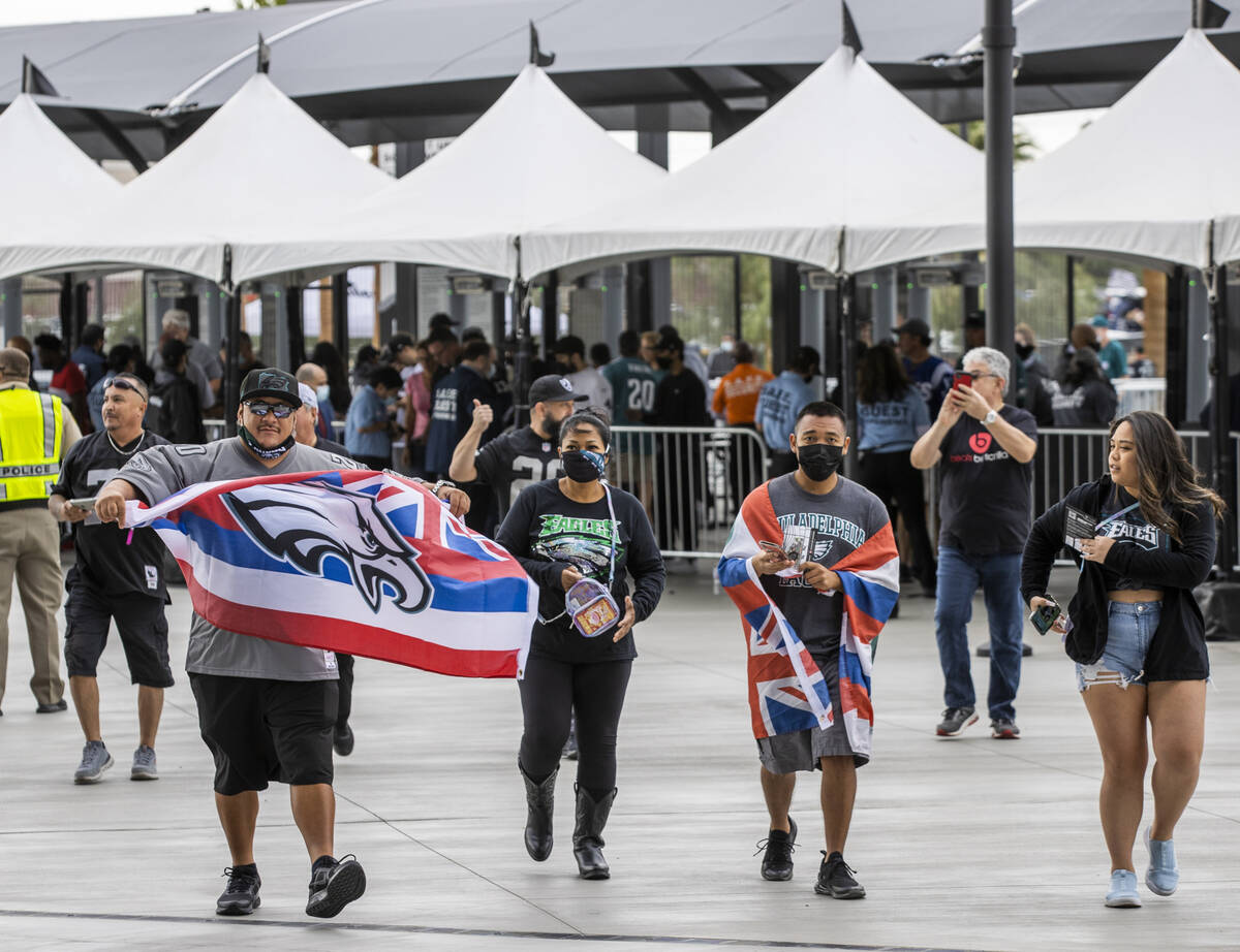Philadelphia Eagles fans arrive to battle the Raiders before the first half of an NFL game at A ...