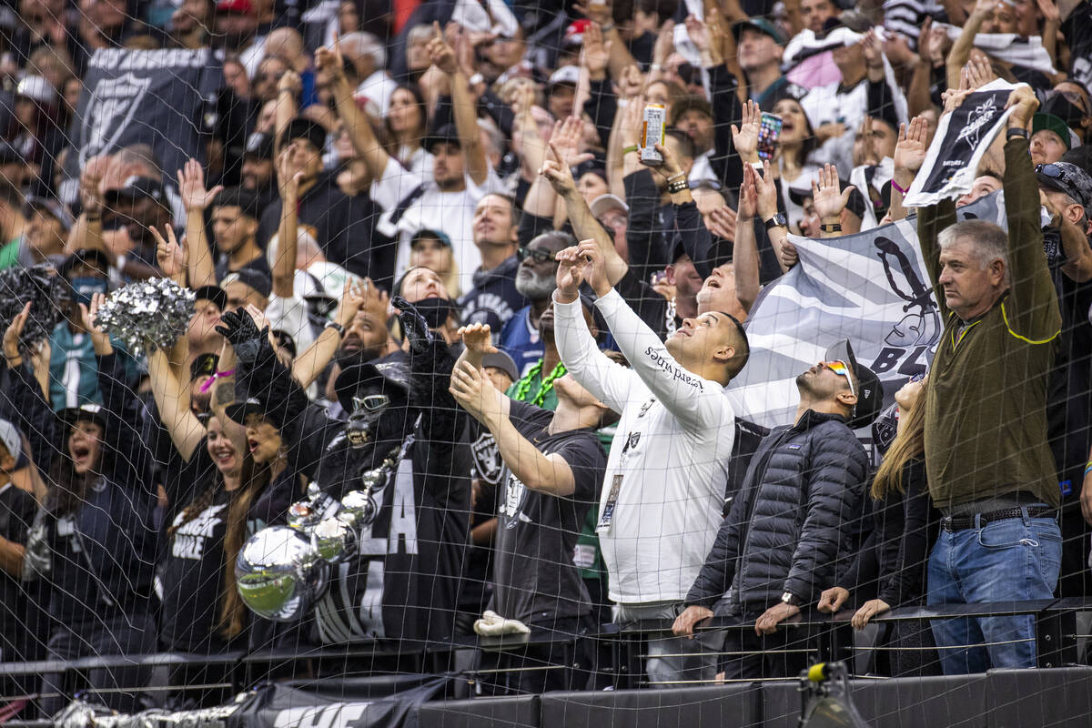 Raiders fans look up for the ball after a score versus the Philadelphia Eagles during the first ...
