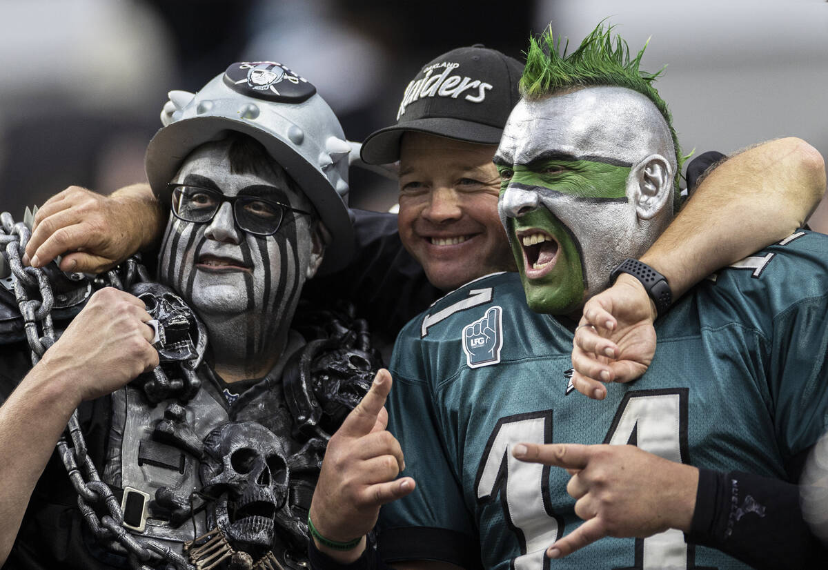 Philadelphia Eagles fans socialize with Raiders fans during an NFL football game on Sunday, Oct ...
