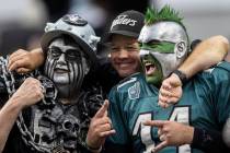 Philadelphia Eagles fans socialize with Raiders fans during an NFL football game on Sunday, Oct ...