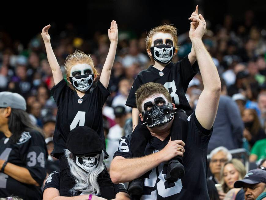 Raiders fans cheer their team during the second half of an NFL football game against the Philad ...