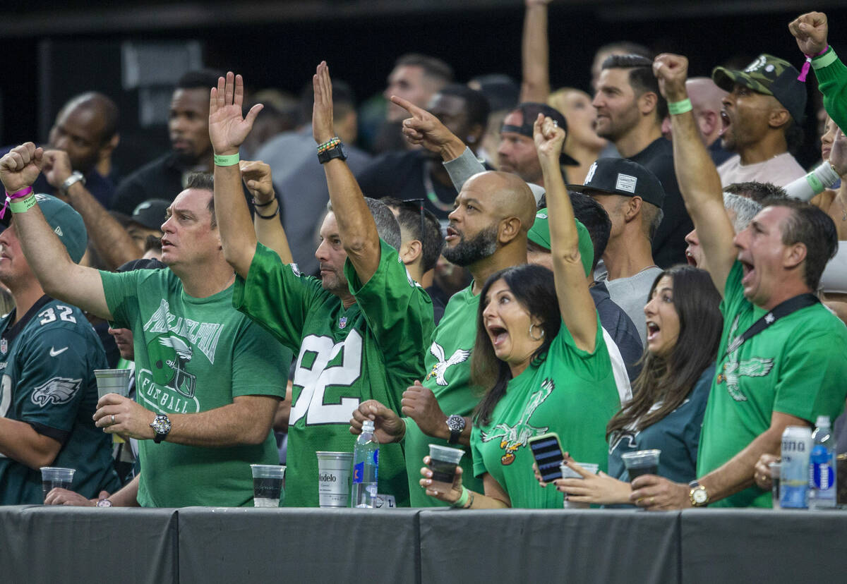 Philadelphia Eagles fans cheer after a touchdown is scored during the first quarter of an NFL f ...