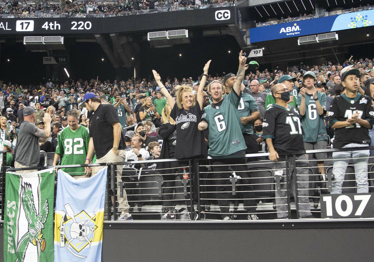 Philadelphia Eagles fans cheer during the first quarter of an NFL football game against the Rai ...
