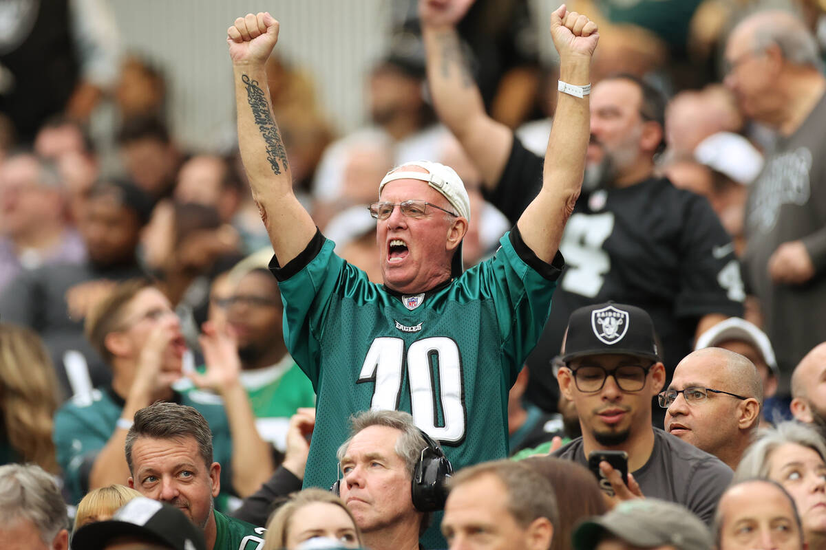 Philadelphia Eagles fans cheer during the first half of an NFL football game against the Raider ...