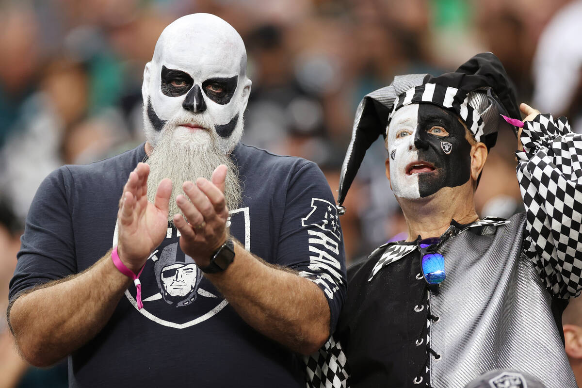 Fans watch the Raiders play the Philadelphia Eagles during the first half of an NFL football ga ...