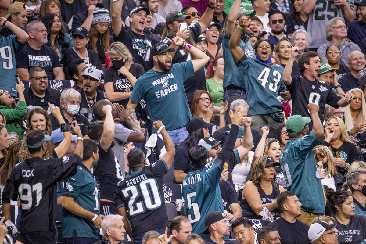 Philadelphia Eagles celebrate a score over the Raiders during the first half of an NFL game at ...
