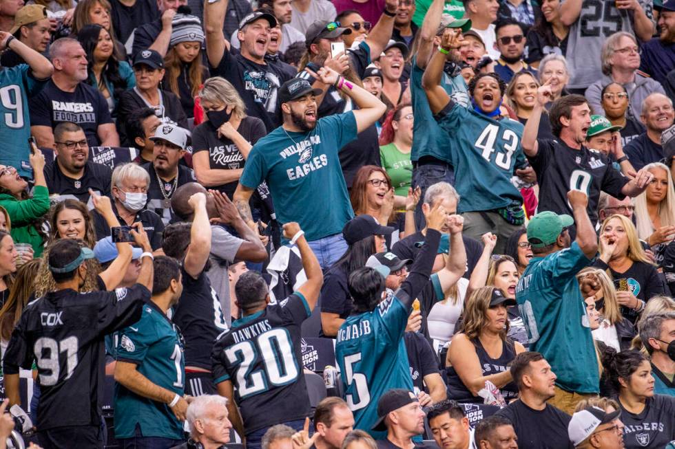 Philadelphia Eagles celebrate a score over the Raiders during the first half of an NFL game at ...
