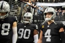 Raiders quarterback Derek Carr (4) waits to lead his team onto the field before the start of an ...