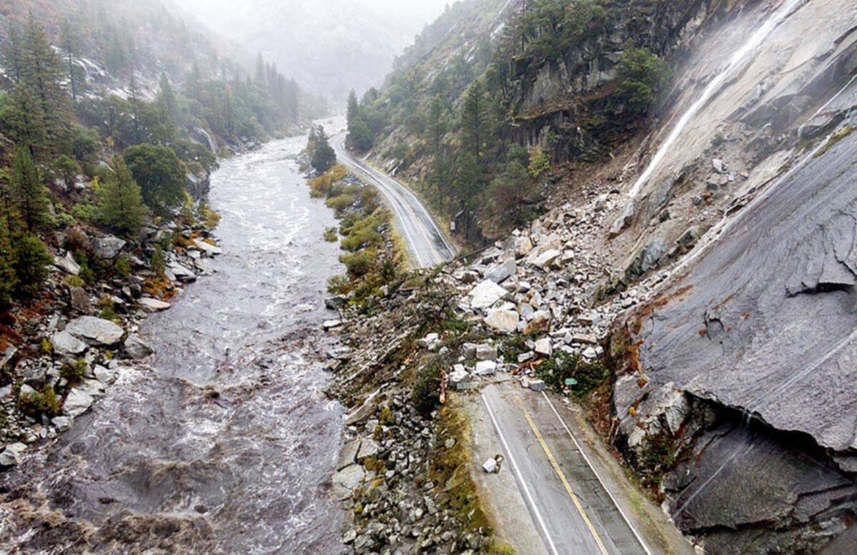 Rocks and vegetation cover Highway 70 following a landslide in the Dixie Fire zone on Sunday, O ...