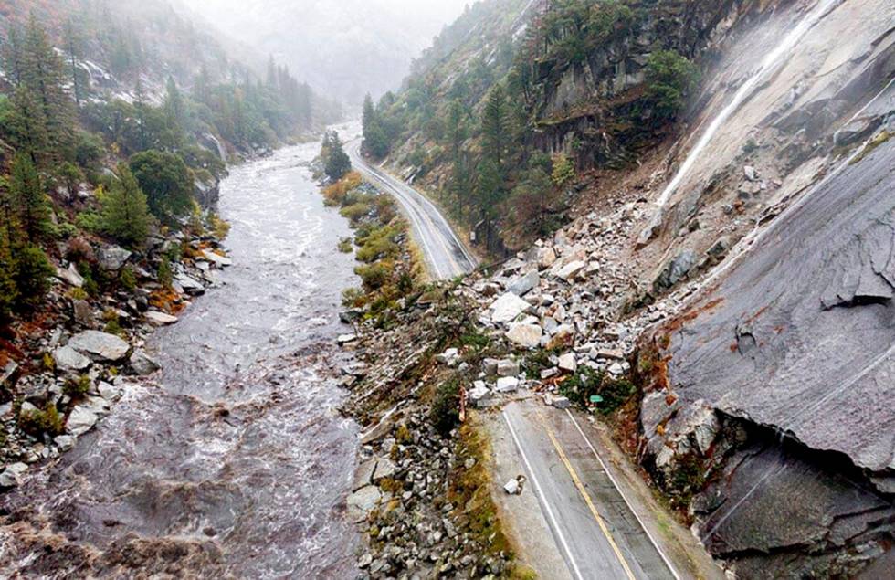 Rocks and vegetation cover Highway 70 following a landslide in the Dixie Fire zone on Sunday, O ...