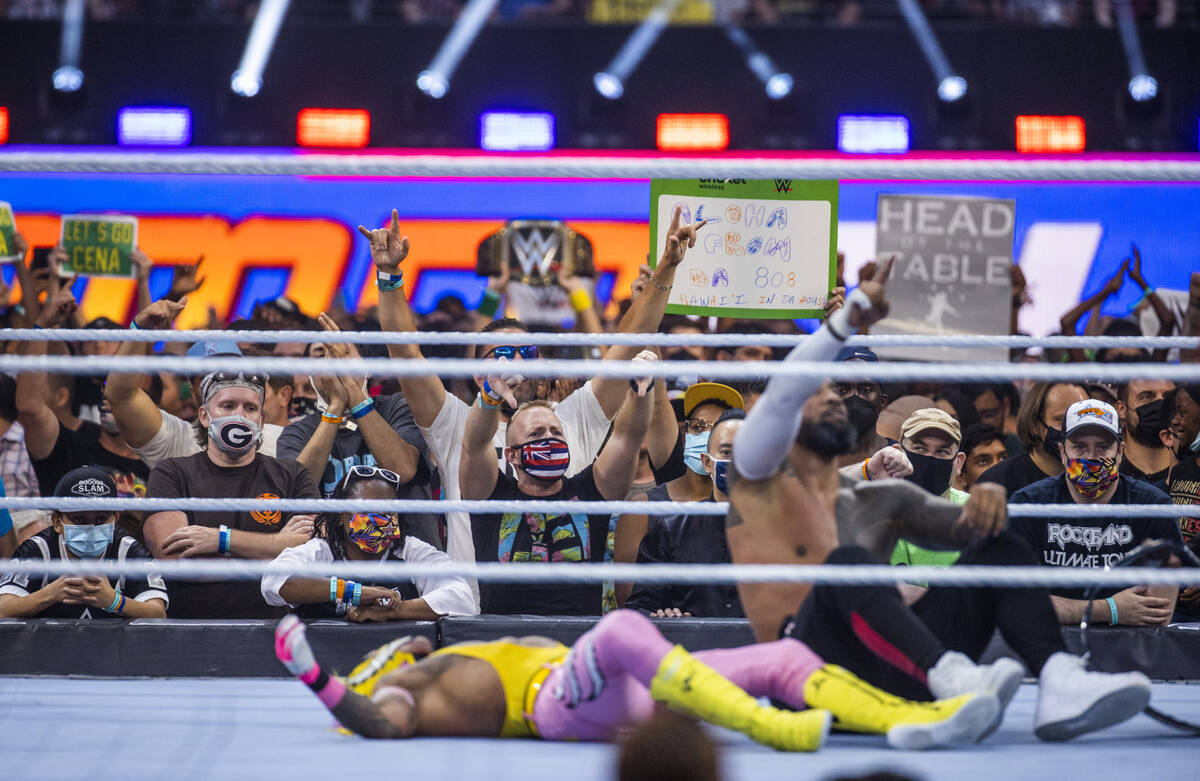 The fans celebrate as Jimmy Uso, right, has pinned Dominik Mysterio in the SmackDown Tag Team C ...