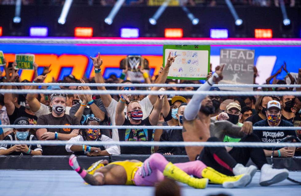 The fans celebrate as Jimmy Uso, right, has pinned Dominik Mysterio in the SmackDown Tag Team C ...