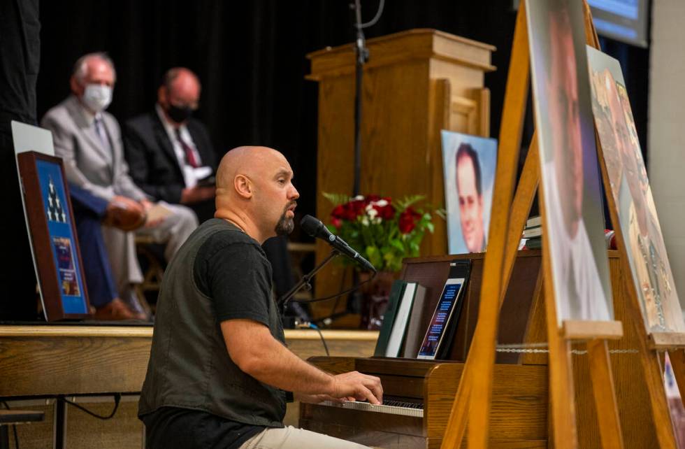 Performer Kyle Martin plays a Billy Joel song during a public memorial service for former Metro ...