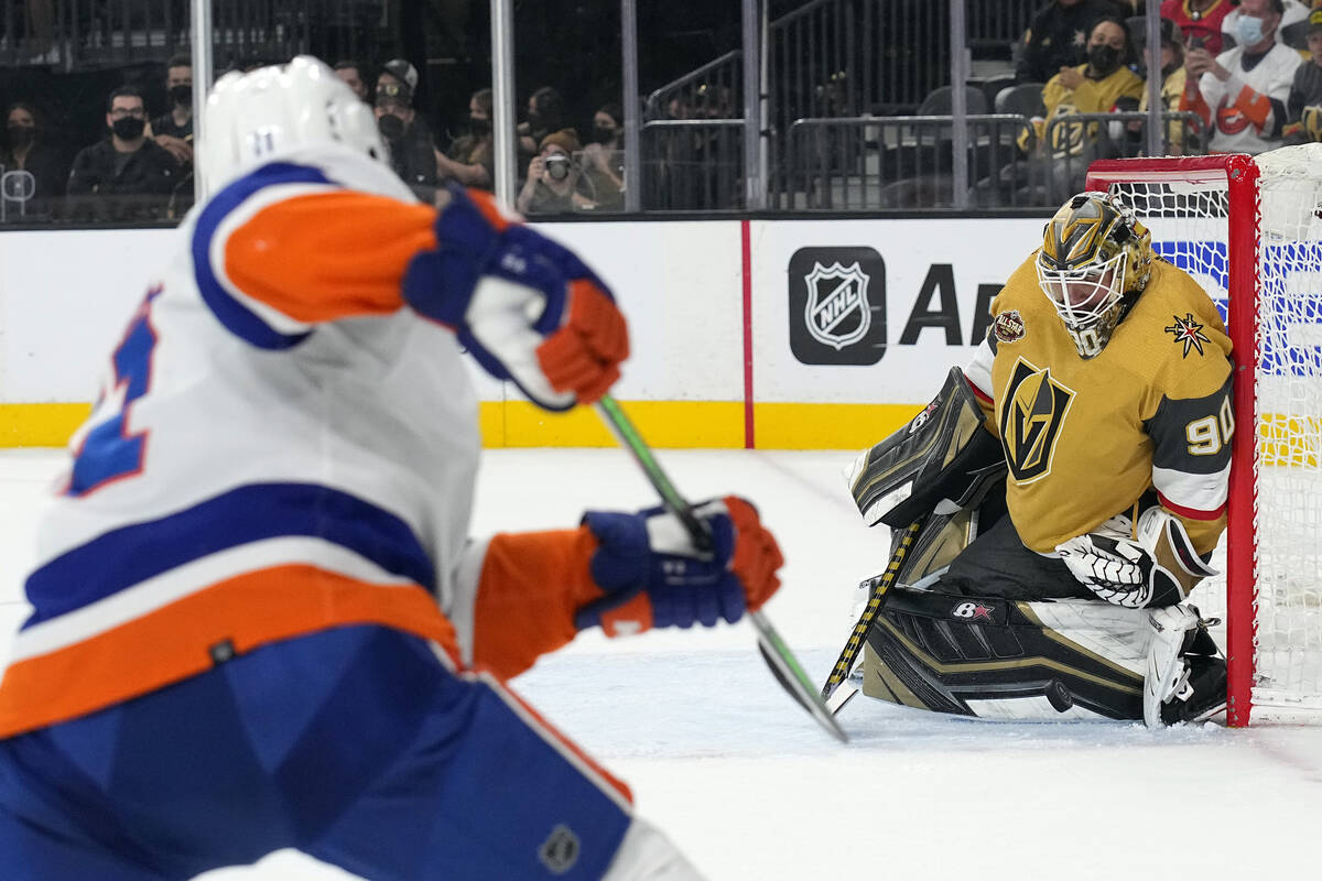 Vegas Golden Knights goalie Robin Lehner (90) makes a save against New York Islanders left wing ...