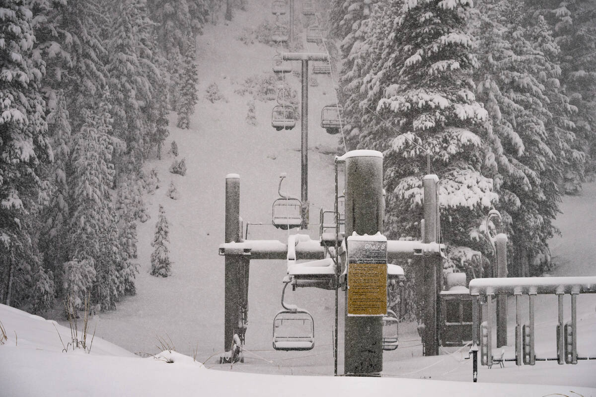 In this photo provided by Mammoth Mountain Ski Area, snow falls on Mammoth Mountain, Monday, O ...