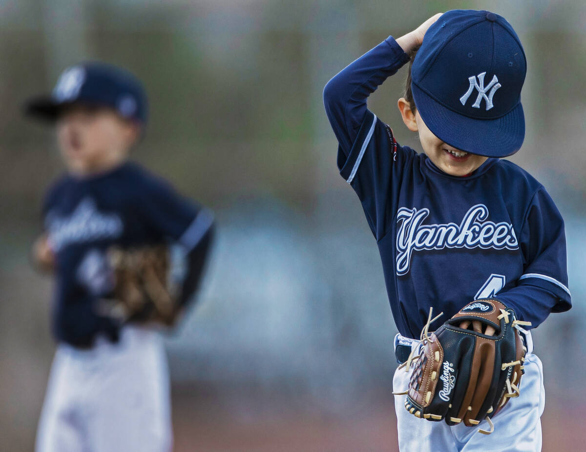 Yankees player Gunnar Cross (4) runs off the field with a smile on his face during a tee ball g ...