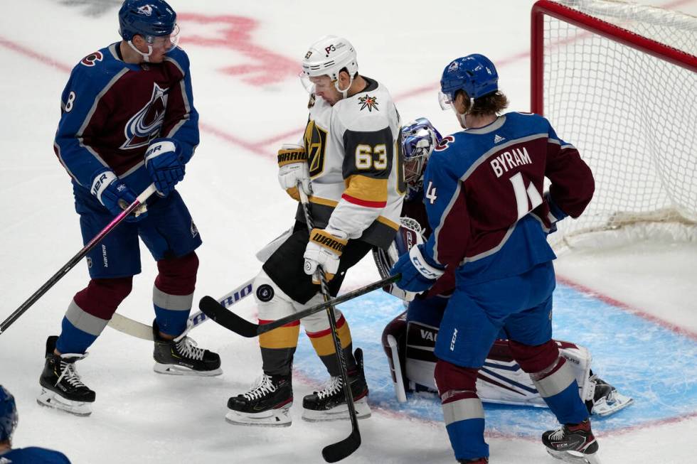 Vegas Golden Knights right wing Evgenii Dadonov (63) takes the puck off his knee as Colorado Av ...