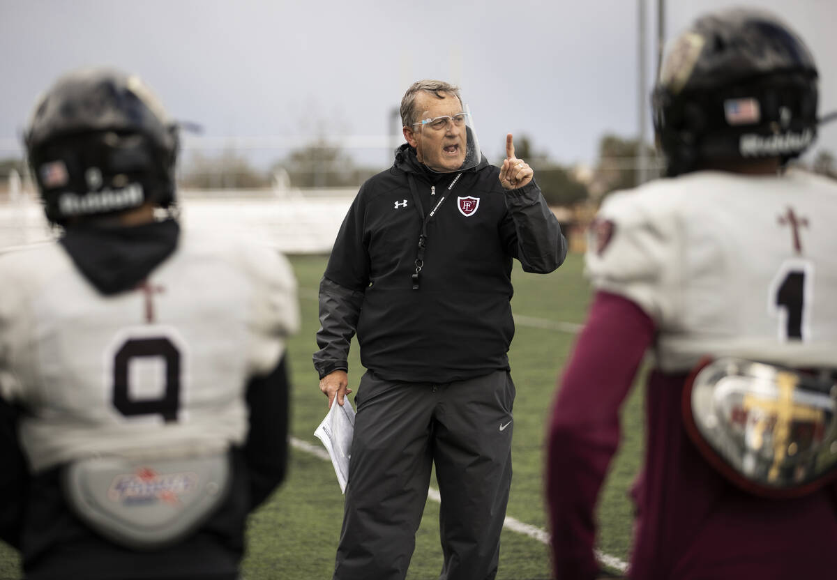In this March 11, 2021, file photo, Faith Lutheran head football coach Mike Sanford leads pract ...