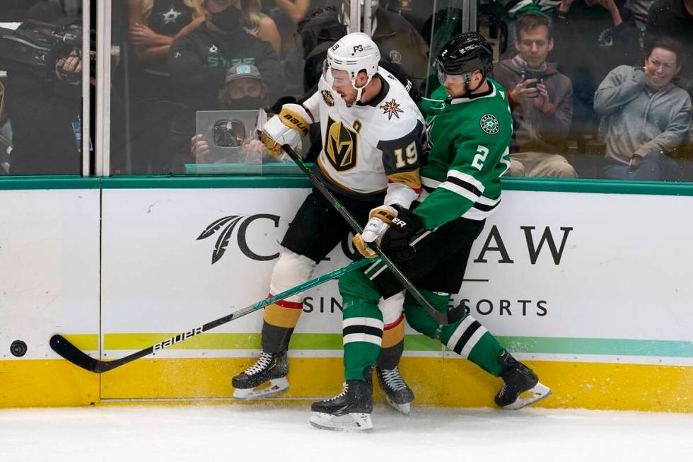 Vegas Golden Knights right wing Reilly Smith (19) and Dallas Stars defenseman Jani Hakanpaa (2) ...