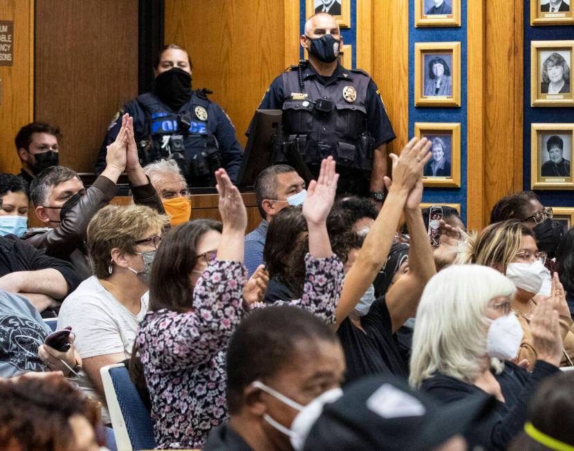 Attendees applaud after the board of trustees voted to oust Superintendent Jesus Jara from his ...