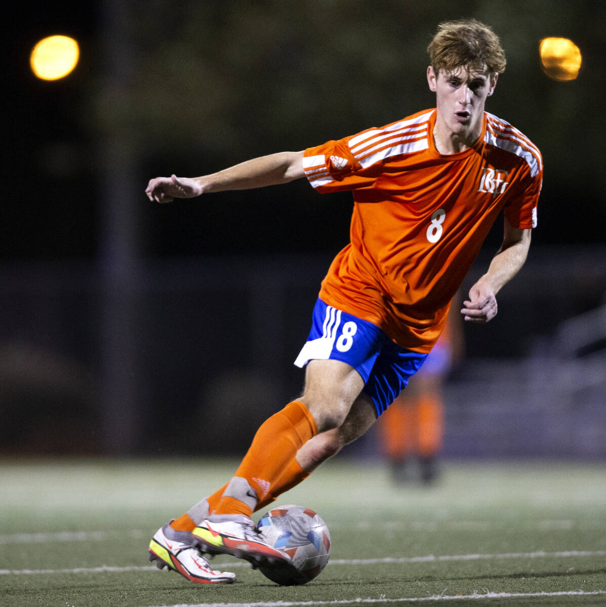 Bishop Gorman's Nathaniel Roberts (8) dribbles right before scoring a goal during a high school ...