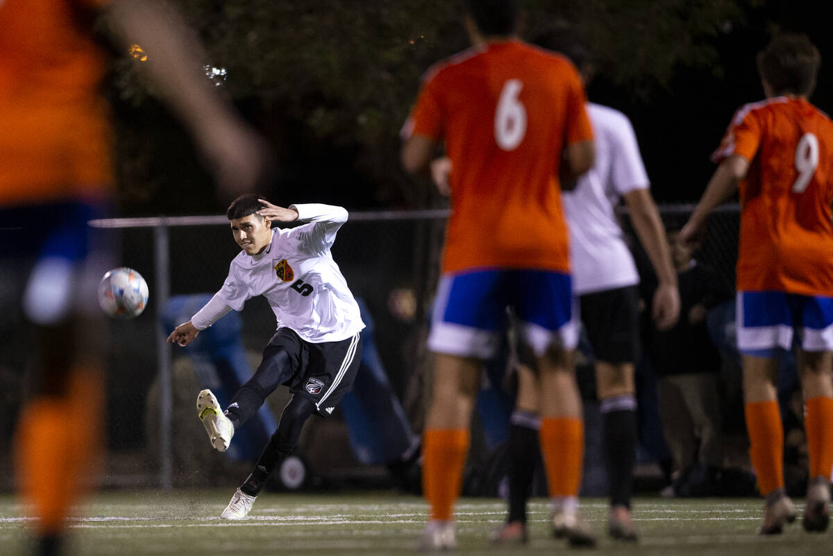 Las Vegas' Hector Macias (5) passes during a high school soccer game against Bishop Gorman at B ...
