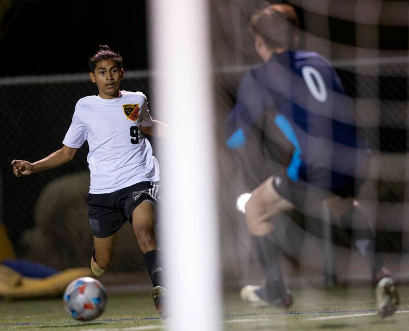 Las Vegas' Cristian Valencia (9) runs to attempt a goal on Bishop Gorman's Tanner Colwell (0) d ...