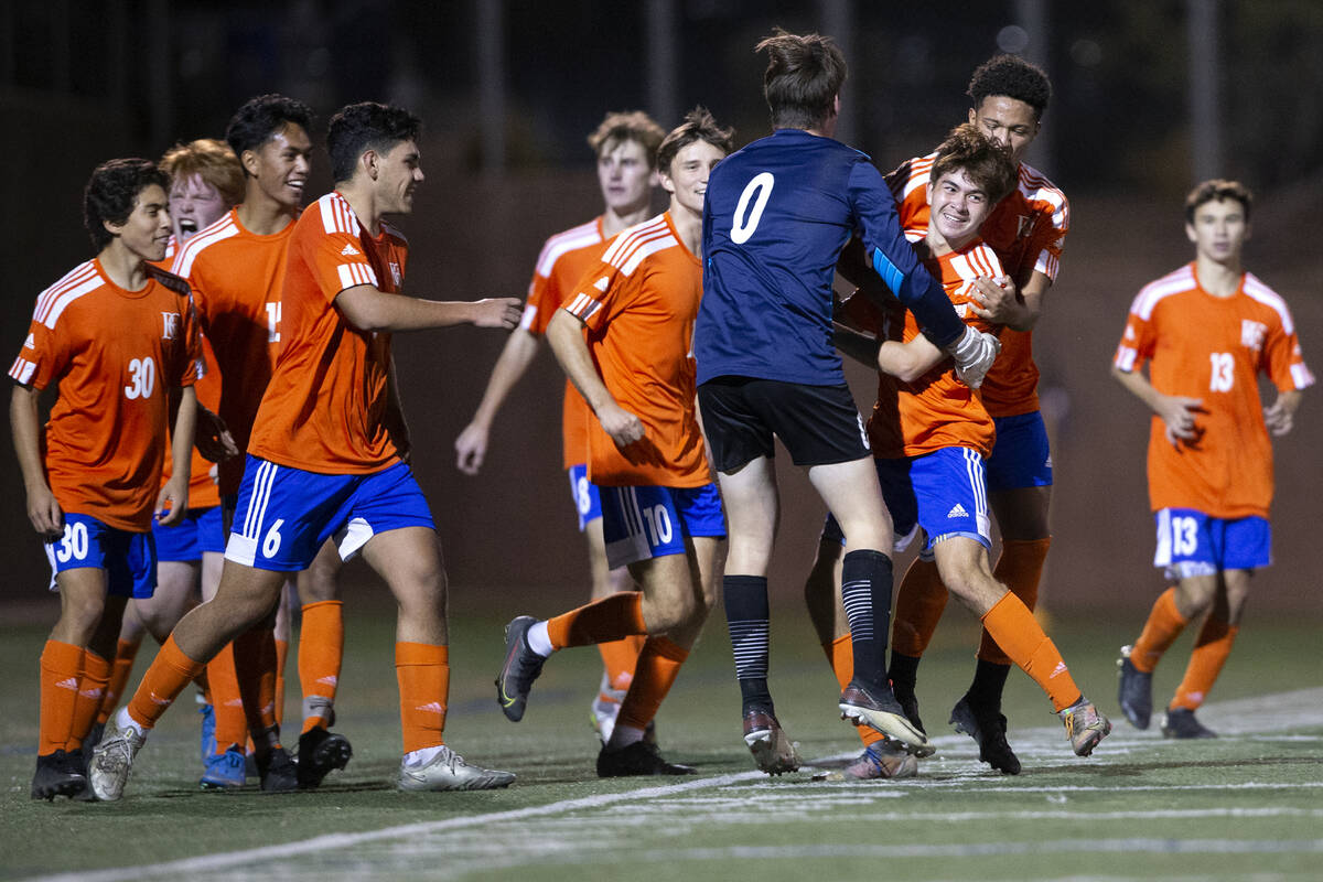 Bishop Gorman players celebrate after Caedon Cox (9) scored a goal against Las Vegas during a h ...