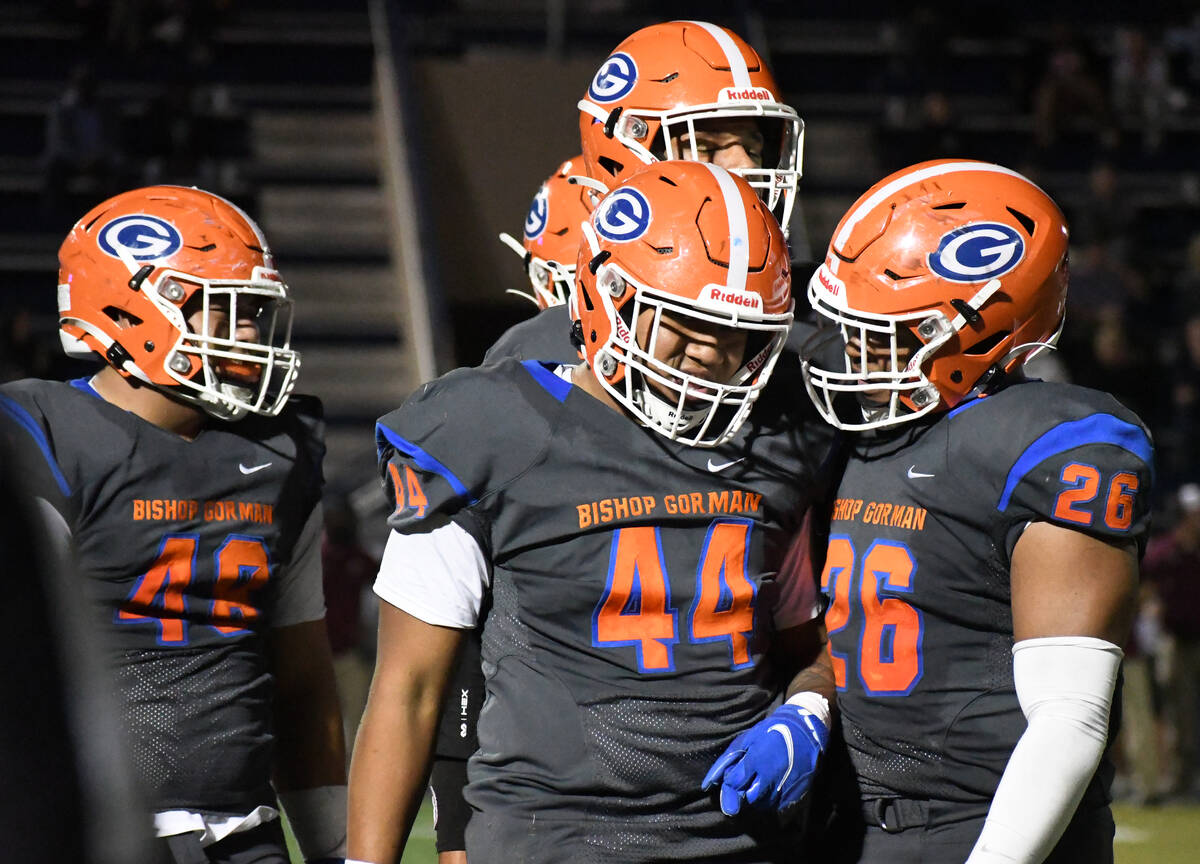 The Bishop Gorman defensive line celebrates a sack during the first half of a Class 5A playoff ...