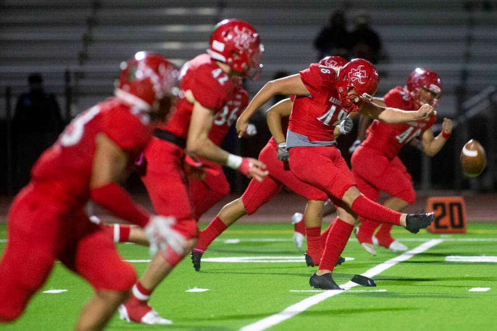 Arbor View's Sam Cassano (48) kicks off during the second half of a high school football game a ...