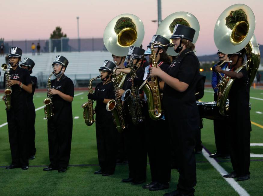 Liberty High School's marching band performs before a football game against Legacy High School, ...