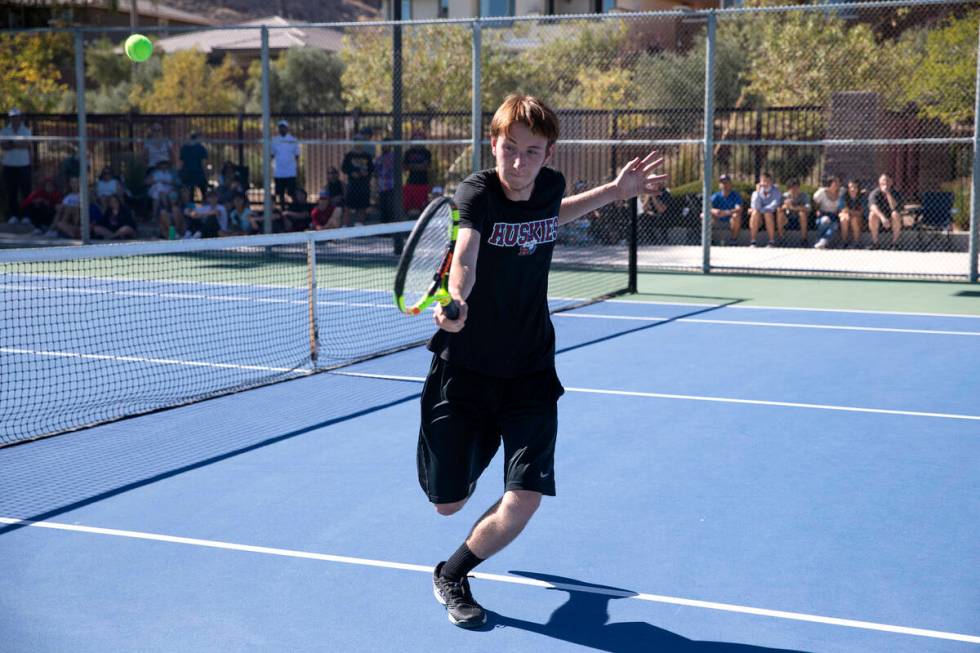 Reno's Jeffrey Rinehart hits to Faith Lutheran during a boys doubles class 5A championship matc ...