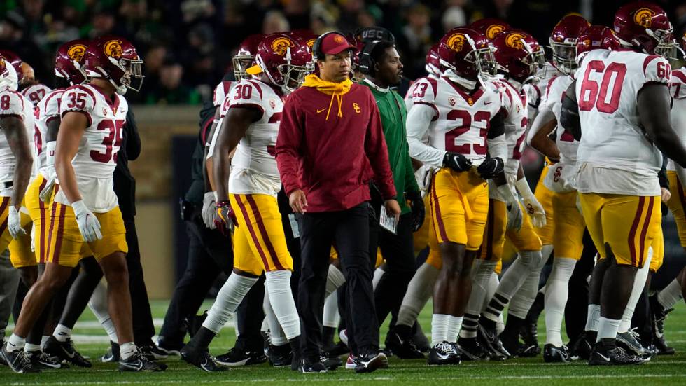 Southern California head coach Donte Williams with his team during a time out against Notre Dam ...