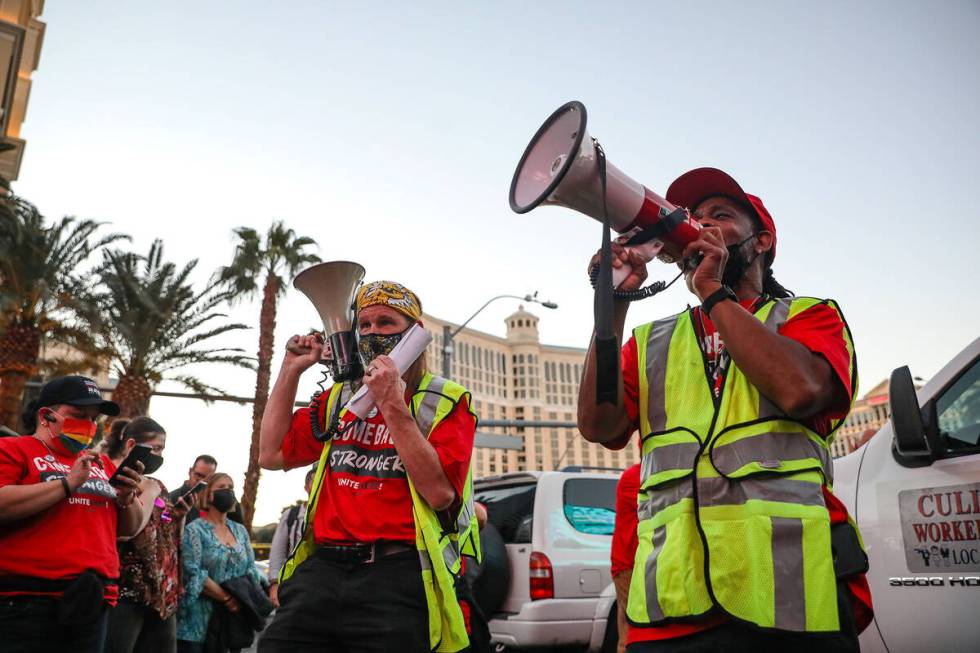 Chad Neanover, left, and James Reed, right, both organizers, cheer on the crowd at a rally of t ...