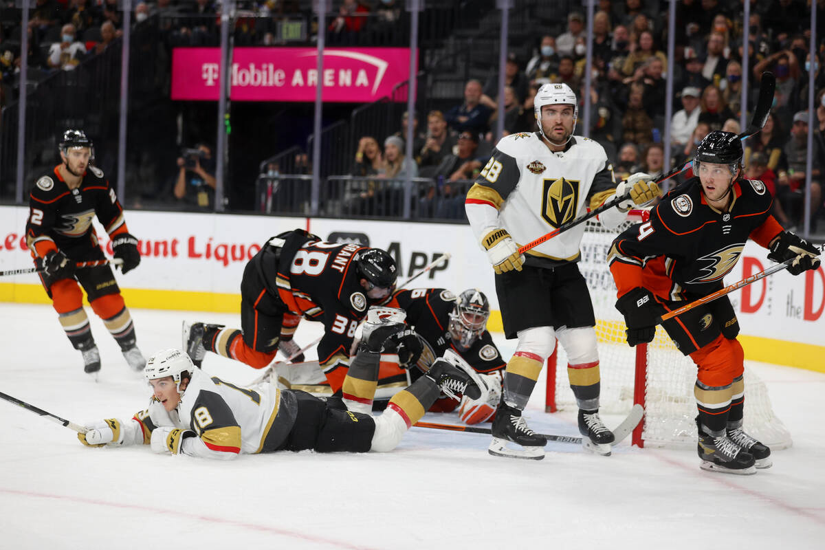 Vegas Golden Knights center Peyton Krebs (18) takes a fall while attacking the Anaheim Ducks go ...