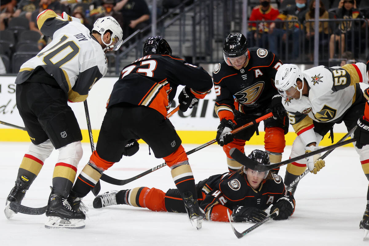 Anaheim Ducks defenseman Josh Manson (42) falls over the puck to end an offensive play by the V ...