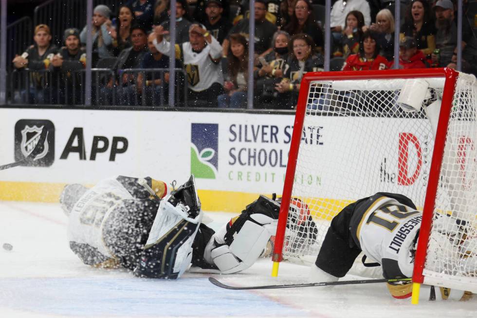 Vegas Golden Knights center Jonathan Marchessault (81) crashes into the goal while defending ag ...