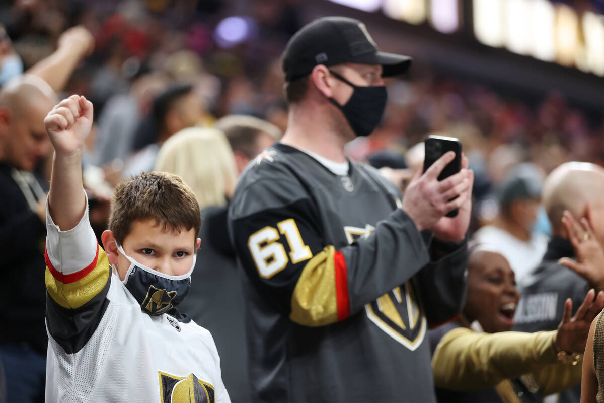 Fans celebrate the Vegas Golden Knights shootout win against the Anaheim Ducks during an NHL ho ...